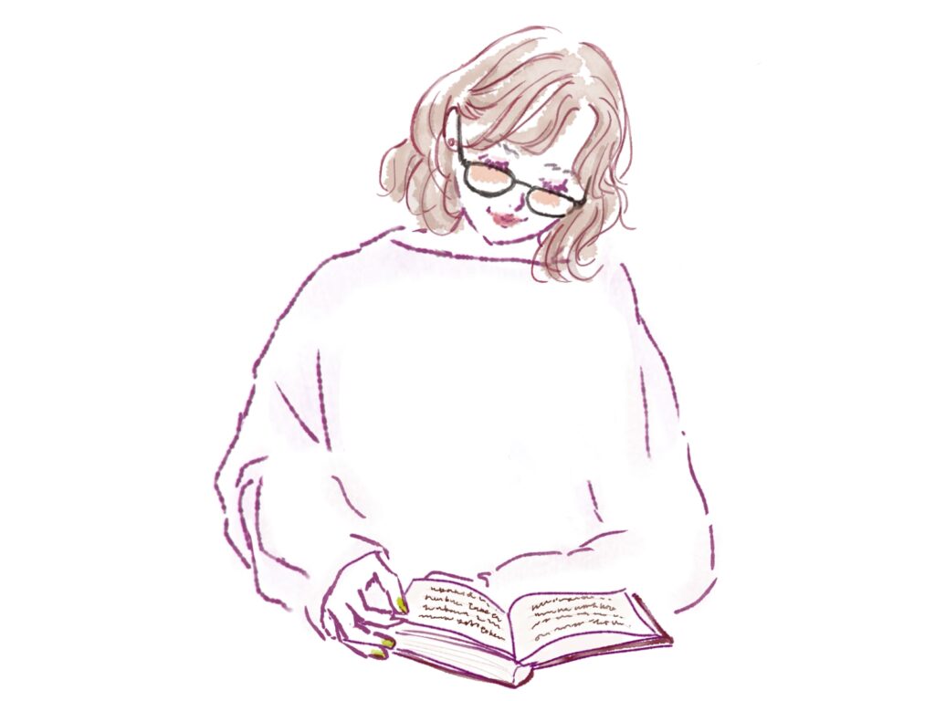 昔を思い出しながら本を読む女性。